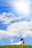 Woman relaxing on hill otdoors